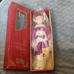 Artisan Collection Purple dress Porcelain Doll